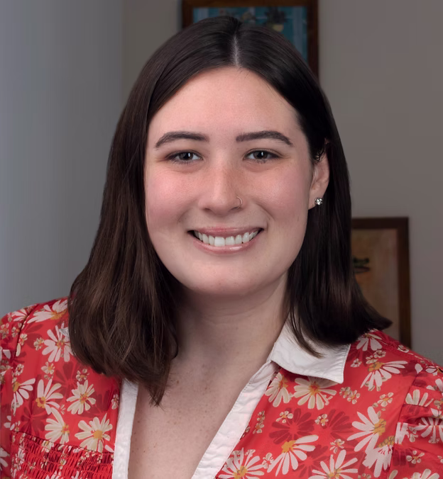 Smiling woman in floral shirt
